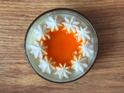 Handmade burnt orange and cinnamon dessert candle in luxury jar