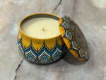 Decorative candle in a yellow moroccan tin 