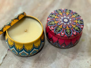 Decorative Festive candles in a colourful tin with a matching lid 