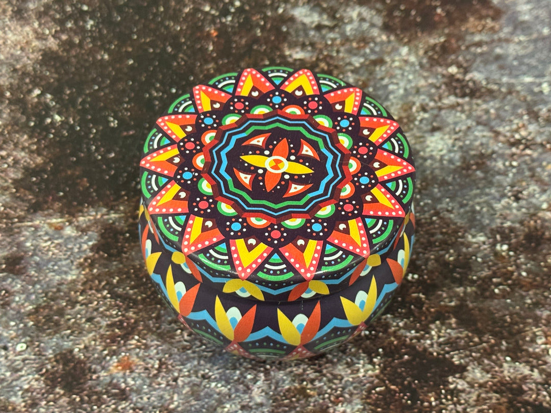 Hand-poured soy wax candle inside decorative Moroccan tin jar