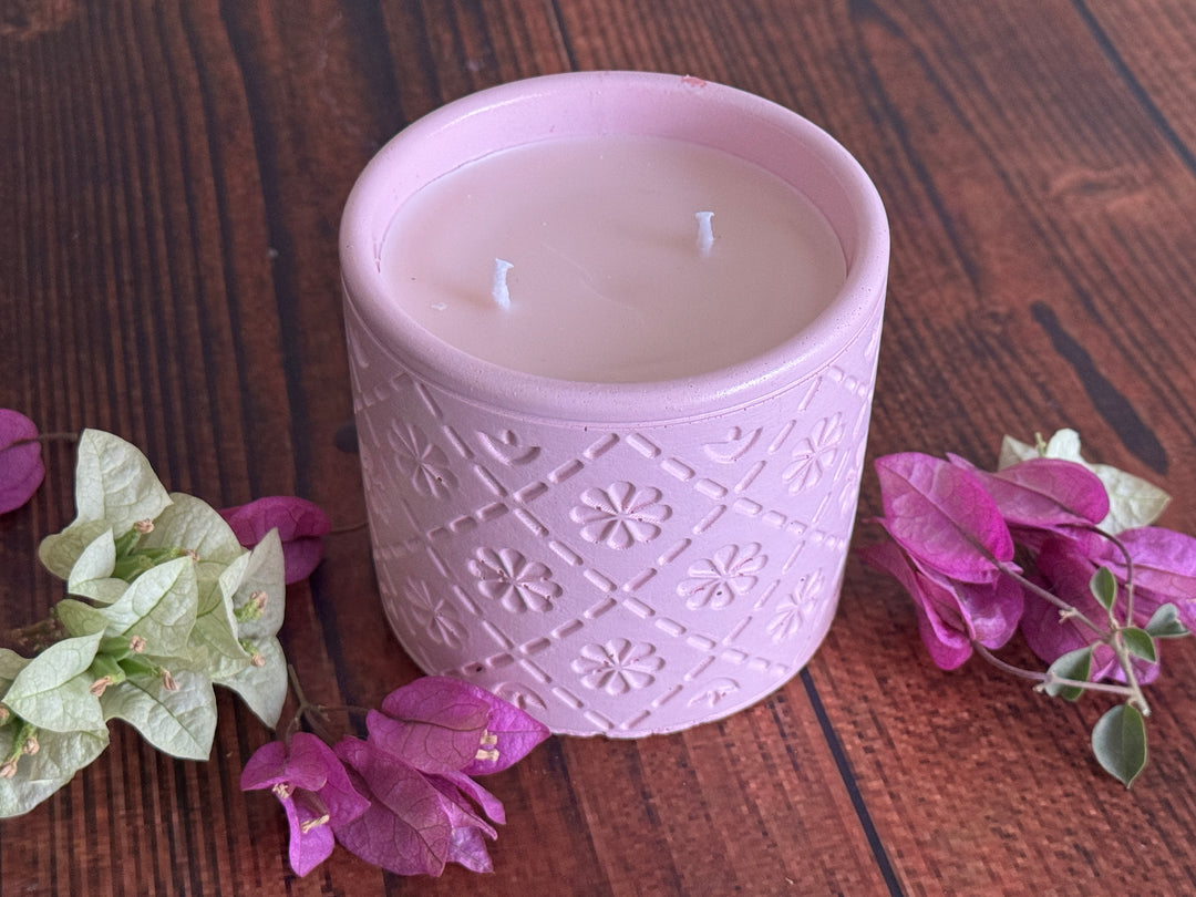 Pink candle with decorative pattern 