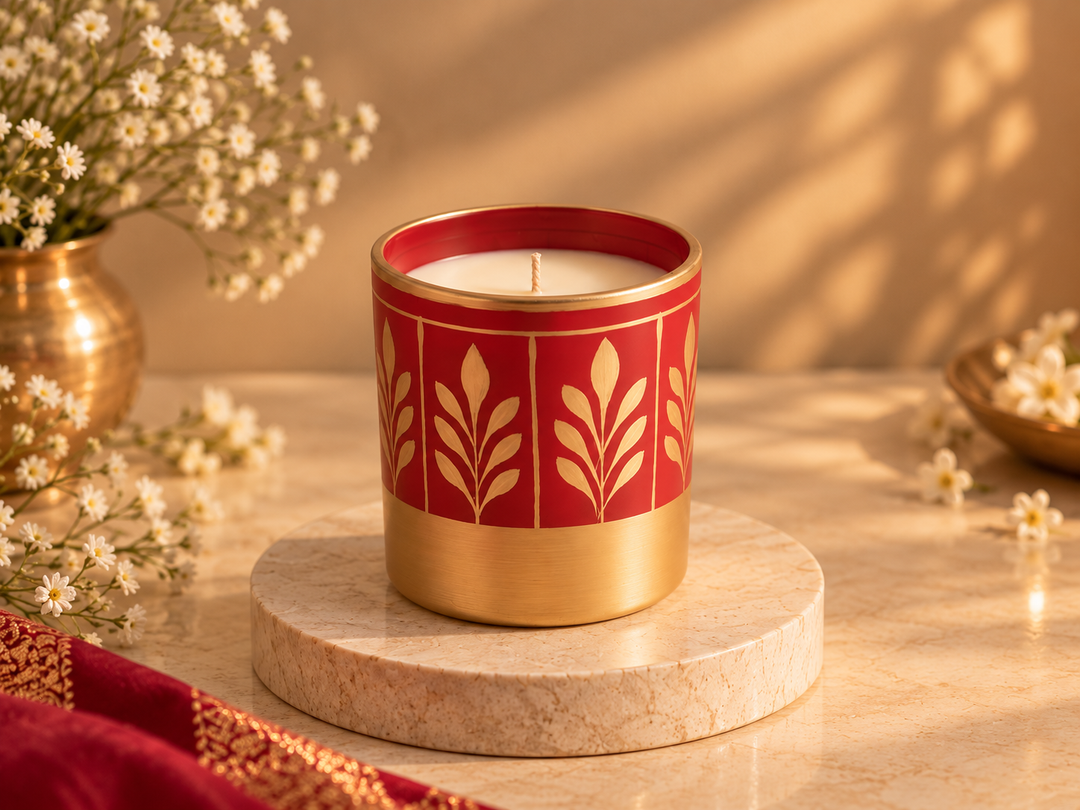 Luxury red and gold decorative and scented candle featuring a botanical floral design.