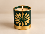 Emerald green Japanese Cherry Blossom scented candle with gold floral detailing and a luxurious gold-tone base.