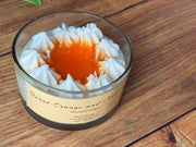 Luxury dessert candle with whipped wax detailing and warm festive tones