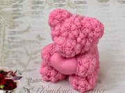 A pink bear-shaped candle made of soy wax, with a cotton wick, perfect for gifting