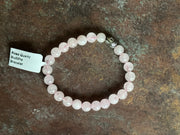 Heartstone Glow Candle with a Rose quartz Bracelet