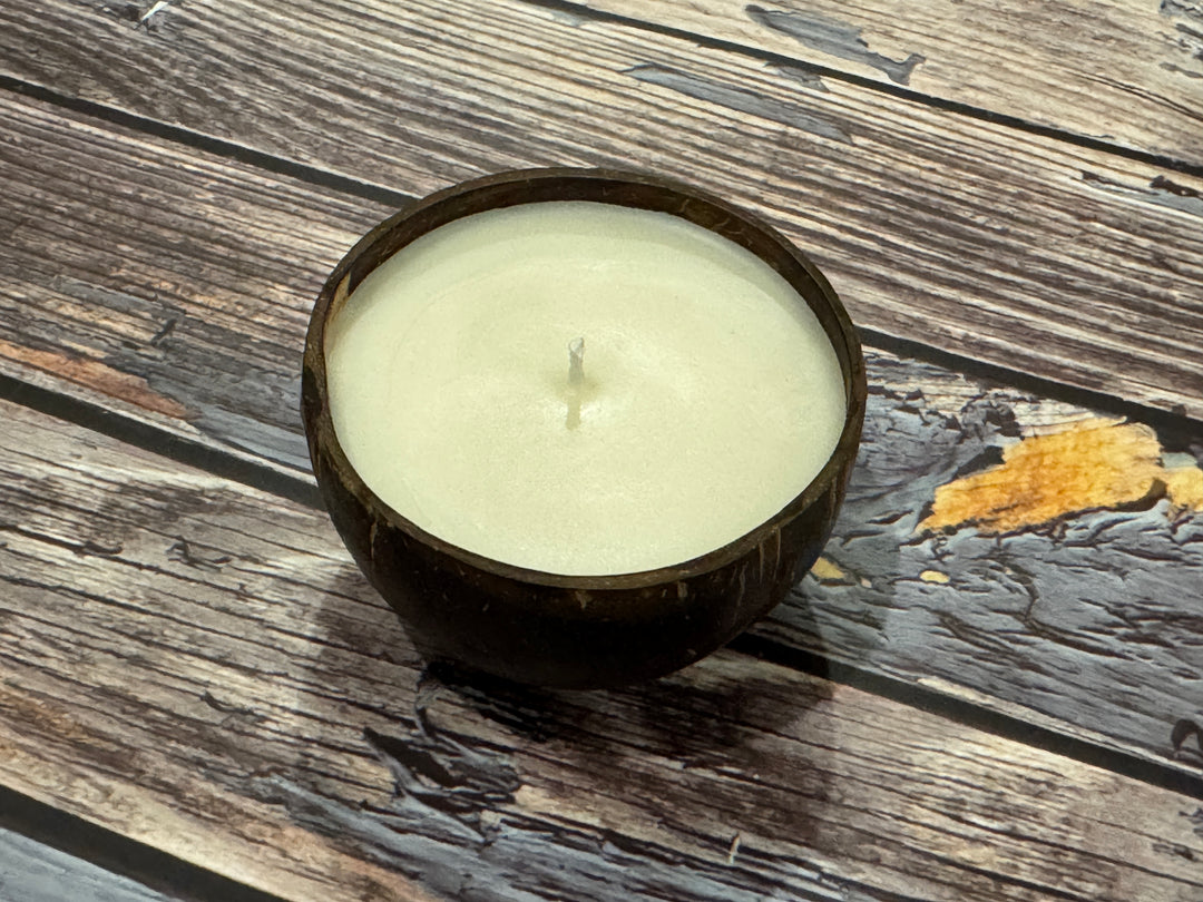 Scented coconut shell candle glowing with warm cozy ambiance