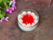 Handmade pomegranate dessert candle with rich red tones
