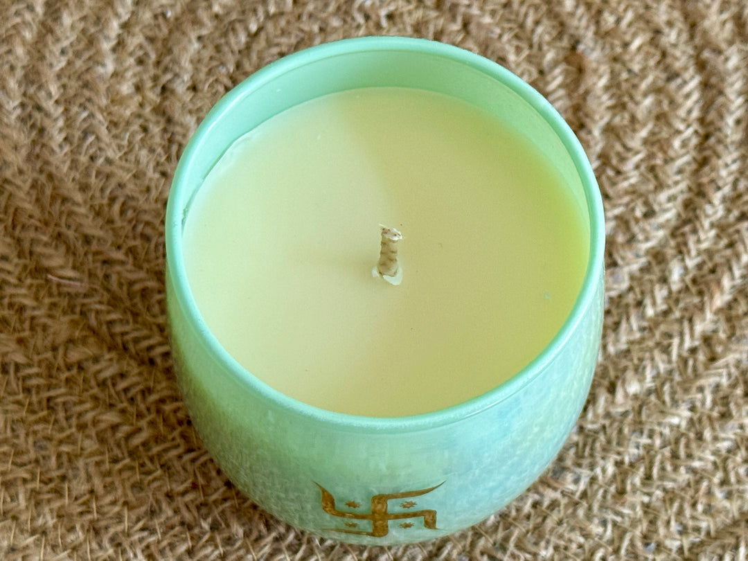 Handcrafted festive candle with rainbow effect glass jar