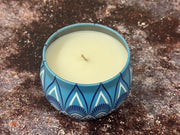 Hand-poured soy wax candle inside decorative Moroccan style tin container